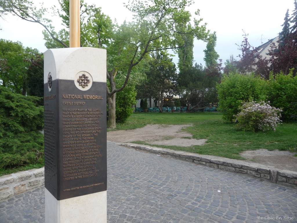 Obelisk in Buda Castle District displaying some of the area's history